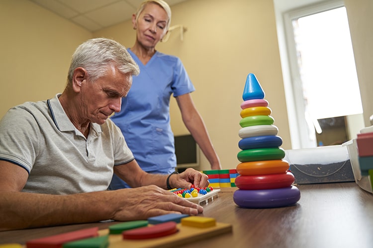 elderly person playing memory games who has dementia